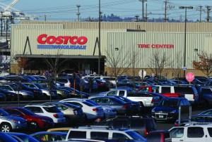 Cars fill the parking lot of a Costco store in Seattle on Tuesday. Health authorities said chicken salad from Costco has been linked to at least one case of E. coli in Washington state.  The Associated Press
