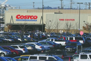 Cars fill the parking lot of a Costco store Tuesday in Seattle. Health authorities say chicken salad from Costco has been linked to at least one case of E. coli in Washington state. The Associated Press
