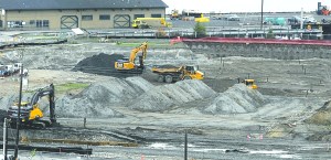 Excavators and bulldozers remove dirt at the site of the former KPly mill in Port Angeles in October. Keith Thorpe/Peninsula Daily News
