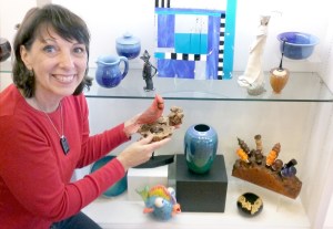 Artist Karin Anderson prepares the holiday gift show at downtown Sequim's Blue Whole Gallery.