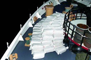 Bales of marijuana that were seized during a smuggling interdiction are stacked on the deck of Coast Guard cutter Active on Dec. 2. U.S. Coast Guard