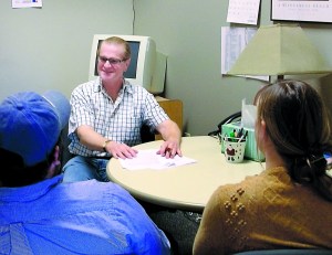 Rich Ciccarone meets with clients in the OlyCAP/Home Fund office in Port Townsend in 2010