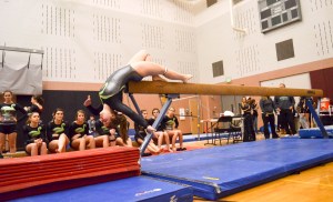 Port Angeles sophomore Nikaila Price performs on the beam during a five-school meet at Kentlake High School.