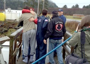 Crew members of the fishing vessel Norn are reunited with loved ones after their vessel took on water and sank 38 miles west of La Push on Thursday. Senior Chief Petty Officer Cory Wadley/U.S. Coast Guard