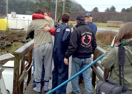 Crew members of the fishing vessel Norn are reunited with loved ones after their vessel took on water and sank 38 miles west of La Push on Thursday. Senior Chief Petty Officer Cory Wadley/U.S. Coast Guard