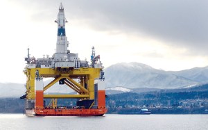 The oil drilling platform Polar Pioneer sits atop the semi-submersible transport ship Dockwise Vanguard in Port Angeles Harbor on Tuesday.  Keith Thorpe/Peninsula Daily News