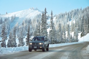 A motorist drives down Hurricane Ridge Road in 2010. Peninsula Daily News