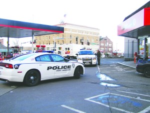 Port Angeles Police Department cruisers parked in front of the Texaco Food Mart at Lincoln and First streets on Monday while officers interview witnesses after reports of a possible child kidnapping triggered a multi-agency alert. Arwyn Rice/Peninsula Daily News