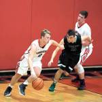 <strong>Steve Mullensky</strong>/for Peninsula Daily News                                Port Townsend Redhawk Kaiden Parcher breaks for the basket during a Crush in the Slush game against the Overlake Owls on Saturday at the high school.