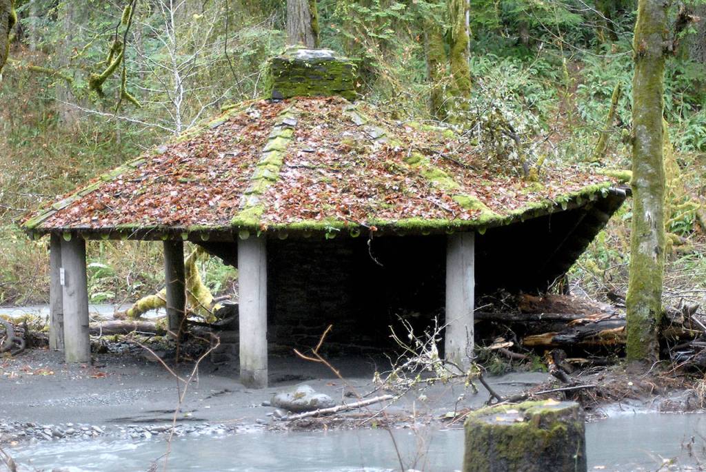 The historic community campground kitchen shelter at the former Elwha Campground sits partially collapsed as a result of flooding of the Elwha River. (Keith Thorpe/Peninsula Daily News)