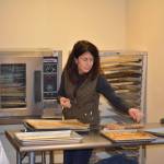 Volunteer Janet Skene works at the Gatheringplace in Port Townsend. (Mark Krulish/for Peninsula Daily News)