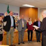 Clallam County Superior Court Judge Erik Rohrer performs an oath of office to Sequim School Board members at the Monday board meeting. From left: Heather Short, Brian Kuh, Jim Stoffer, Robin Henrikson and Brandino Gibson. (Erin Hawkins/Olympic Peninsula News Group)