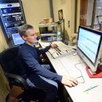 Robert Ambrose, KPTZ board chair and interim general manager, works on a project in a studio Wednesday. (Jesse Major/Peninsula Daily News)
