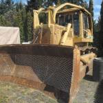 The bulldozer used by Barry Swegle is shown impounded by the Clallam County Sheriffs Office in May 2015. (Keith Thorpe/Peninsula Daily News)