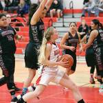 Steve Mullensky/for Peninsula Daily News Port Townsends Kaitlyn Meek keeps here eyes on the basket while driving for a score during the opening match-up of the 2016 Crush in the Slush against the Wahluke Warriors at Port Townsend High School on Thursday.