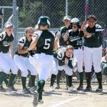 Port Angeles Natalie Steinman, 5, reaches home plate to a resounding welcome after hitting a two-run home run in the Riders 13-2 win over White River in the district championship last Saturday. (Lonnie Archibald/for Peninsula Daily News)