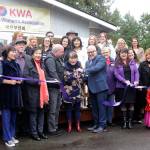 The Korean Womens Association celebrates the opening of a supported living facility on Kirk Road on Dec. 18. On-hand at the ribbon-cutting are, at center, Sequim Mayor Dennis Smith, KWA senior advisor/founding member Sulja Warnick and KWA Executive Director Troy Christensen. (Michael Dashiell/Olympic Peninsula News Group)