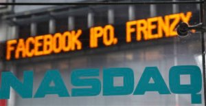 News about the Facebook IPO passes on a billboard outside of Nasdaq in Times Square