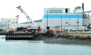 A construction crane sits near the lagoon at the Nippon Paper Industries USA mill in Port Angeles on Friday. Construction of a cogeneration plant  under way at the paper mill has forced organizers of the annual Duck Derby to find an alternate location for the event. Keith Thorpe/Peninsula Daily News