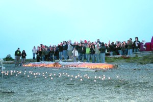 About 200 people gather on Ediz Hook in a candlelight vigil to remember Sarah Garcia-Hutto last week after the 26-year-old Port Angeles woman's death. Kaitlin Buckmaster