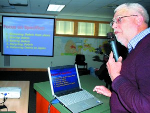 Curt Ebbesmeyer tells a Sequim audience that they should be prepared for flotsam along the Pacific coast. Jeff Chew/Peninsula Daily News