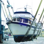 The Gray Hawk is shown in the slings of Platypus Marines TraveLift en route to the Port Angeles facility.  -- Photo by David G. Sellars/for Peninsula Daily News