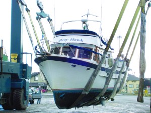 The Gray Hawk is shown in the slings of Platypus Marines TraveLift en route to the Port Angeles facility.  -- Photo by David G. Sellars/for Peninsula Daily News
