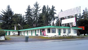 The shuttered Chinook Motel  its large sign whited out  sits depilated at the corner of First and Ennis streets in Port Angeles.  -- Photo by Keith Thorpe/Peninsula Daily News