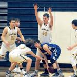 Lonnie Archibald/for Peninsula Daily News Spartans from left, Braton Armas, Seth Johnson, Scott Archibald and Jake Jacoby trap Elmas Cobey Moore during Forks 59-40 Evergreen League win over Elma.