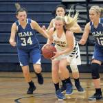 Lonnie Archibald/for Peninsula Daily News Forks Kesia Rowley begins a fast break against Elmas Kali Rambo (34) and Brooke Sutherly (12). Following the play is Spartan Mya Rondeau.