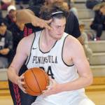 Keith Thorpe/Peninsula Daily News                                Peninsulas Marky Adams tries to evade the defense of Mount Hoods Terrell Walker during a November contest.