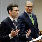 Washington Attorney General Bob Ferguson, left, talks to reporters as Washington Gov. Jay Inslee looks on during the Associated Press annual Legislative Preview last Thursday at the Capitol in Olympia. Inslee and Ferguson slammed the Trump administrations move to roll back Obama-era leniency on legalized marijuana. (Ted S. Warren/The Associated Press)