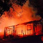 This Sunday night fire destroyed a house in the 1700 block of U.S. Highway 101 at Airport Road in Port Angeles. (Jay Cline/Clallam Fire District No. 2)