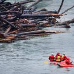 Search and rescue workers make their way down the Elwha River on Monday. (Jay Cline/Clallam County Fire District No. 2)