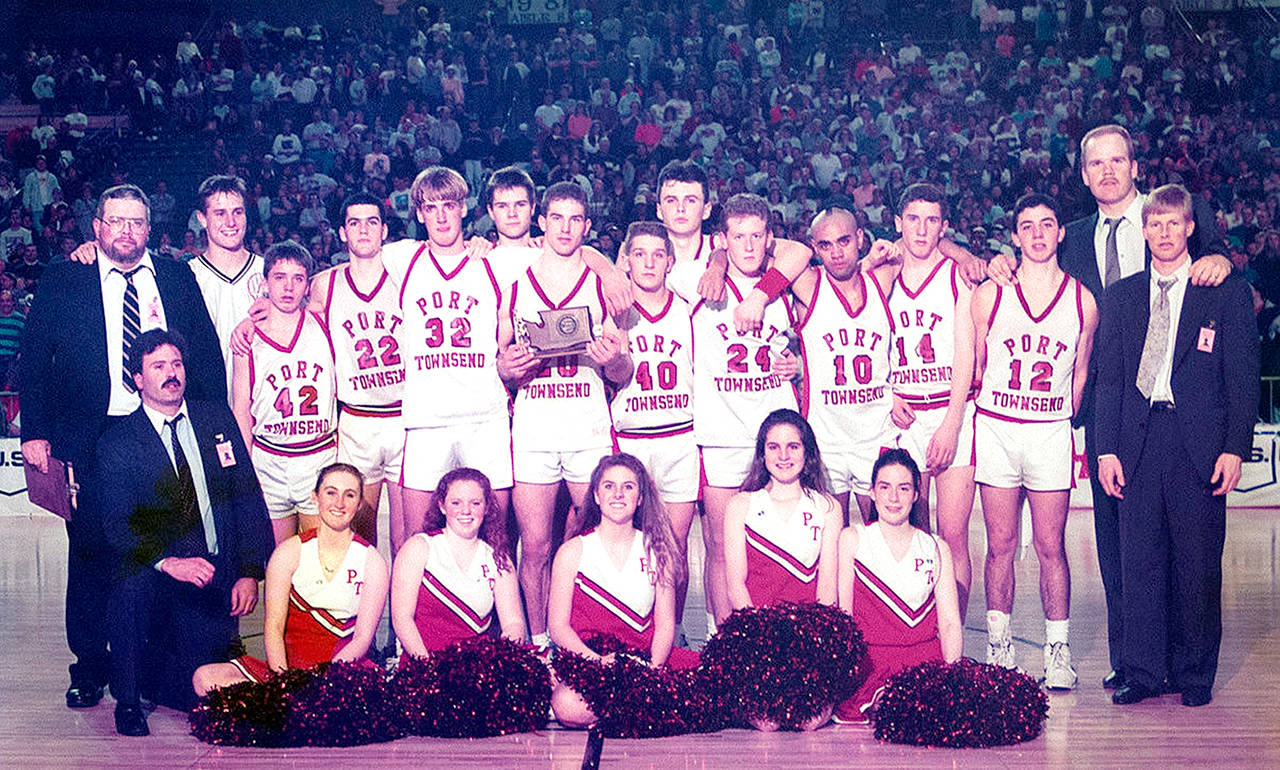 The 1992-93 Port Townsend boys basketball team finished second at the Class A State Basketball Tournament. Coaches and players, from left, back row, coach Tim Black, Calan Taylor, Tanner Logue, Dan Rough, Kevin Maier, Dekker Dirksen, Andy DAgostino (with trophy), Kevin Reid, Luke Eaton, Aaron Speck, Emanuel Abbott, Joe Atkinson, Rich DAgostino, coach John Stroeder, head coach Ryan Robertson; (kneeling, from left) coach Mike Kelly, and cheerleaders Carissa Parker, Ali Armstrong, Kim Erickson, Kim Schubert and Bethany Schultz. Photo: Kris Logue