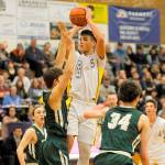 Sequim guard Payton Glasser rises for a jumper over the defense of Port Angeles Colton McGuffey during the Riders 59-52 win. Glasser had 26 points.                                Michael Dashiell/Olympic Peninsula News Group