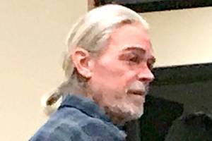 Man whose errant shot hit neighbor checks into treatment center