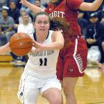 <strong>Keith Thorpe</strong>/Peninsula Daily News                                Peninsulas Ashlynn Sharp, front, passes the ball as she slips around Skagit Valleys Brook Geffe in the third quarter Wednesday night in Port Angeles.