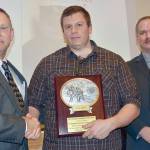 Chief Sam Phillips presents Ian Brueckner with the Career Firefighter of the Year award. Left to right Chief Sam Phillips, firefighter/paramedic Ian Brueckner and Deputy Chief Jake Patterson. (Jay Cline/Clallam County Fire District 2)