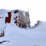 Fourteen-foot snow drifts were sculpted by high wind near the visitor center at Hurricane Ridge in the photograph taken Friday. (Sarah Crosier/National Park Service)