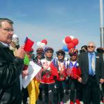 Port Angeles Mayor Dan Di Guilio, left, speaks to a group of bicyclists from Taiwan after their arrival in Port Angeles by ferry in this April 2014 file photo. (Keith Thorpe/Peninsula Daily News)