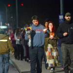 Dozens carrying candles walked the span of the Valley Creak Eighth Street Bridge in Port Angeles Wednesday during a vigil mourning community members who have committed suicide. (Jesse Major/Peninsula Daily News)