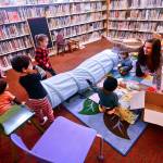 Children play after story time at the Port Townsend Public Library on Tuesday. Officials said that by removing late fees, the library is also making the library more accessible to children. (Jesse Major/Peninsula Daily News)