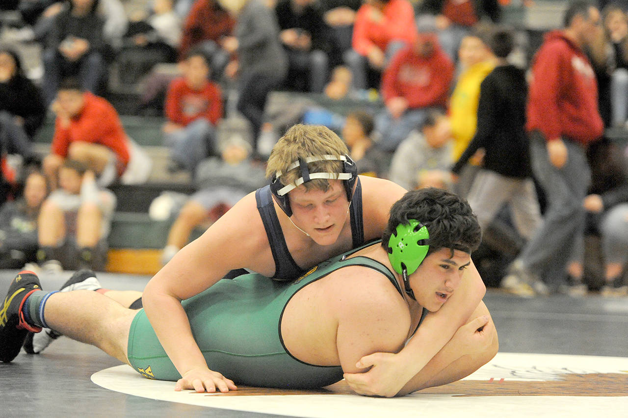 Lonnie Archibald/for Peninsula Daily News                                Forks Luke Dahlgren, top, is a strong contender for the 220-pound wrestling title at Mat Classic XXIX, the state wrestling tournament, this weekend at the Tacoma Dome.