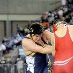 Lonnie Archibald/for the Peninsula Daily News Forks Nate Flores wrestles Arthur Drake of Cascade (Leavenworth) in a 285-pound match at Mat Classic, the state wrestling tournament, Flores reached the semifinals but suffered an injury and was forced to forfeit his final three matches and placed sixth.
