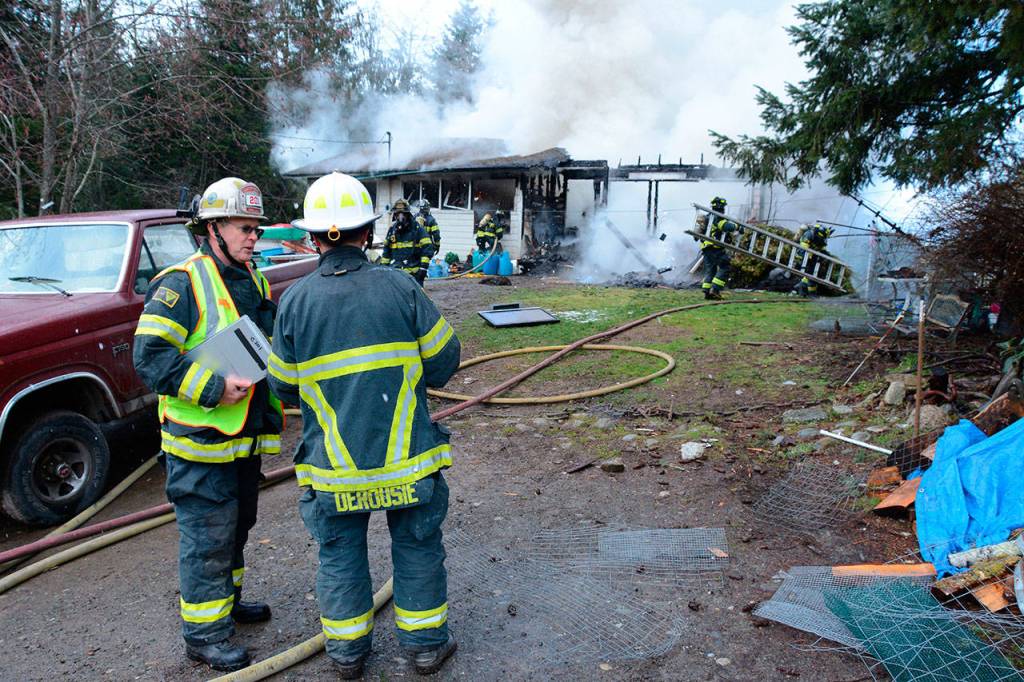 Clallam County Fire District No. 2 responded to a house fire southwest of Port Angeles on Sunday afternoon. (Jay Cline/Clallam County Fire District No. 2)