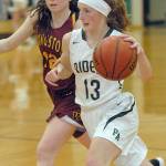 Port Angeles Millie Long sweeps past Kingstons Lily Beaulieu in January at Port Angeles High School. Long, just a freshman, was named Olympic League 2A Division MVP.
