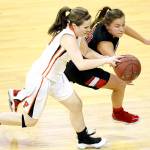 David Willoughby/for Peninsula Daily News Neah Bays Gina McCauley steals the ball from Pomeroys Sydney Smith during the WIAA 1B girls semifinals at the Spokane Arena in Spokane.