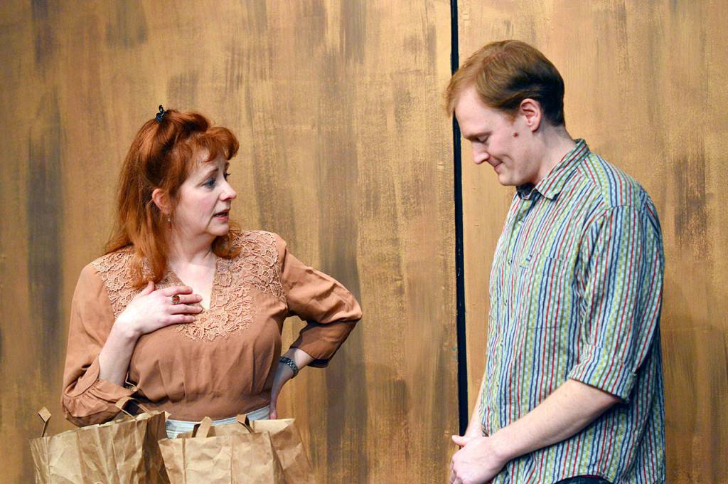 Angela Poynter and Dylan Carter rehearse Family Photographs, local playwright Judith Glass Collins contribution to the 22nd annual PlayFest. The festival opens at Port Townsends Key City Public Theatre this weekend. (Diane Urbani de la Paz/for Peninsula Daily News)