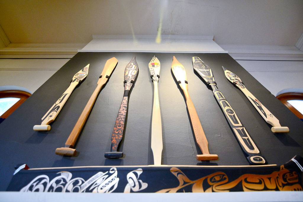 Paddles hang on a wall in the Historic Carnegie Building in Port Angeles on Monday. (Jesse Major/Peninsula Daily News)